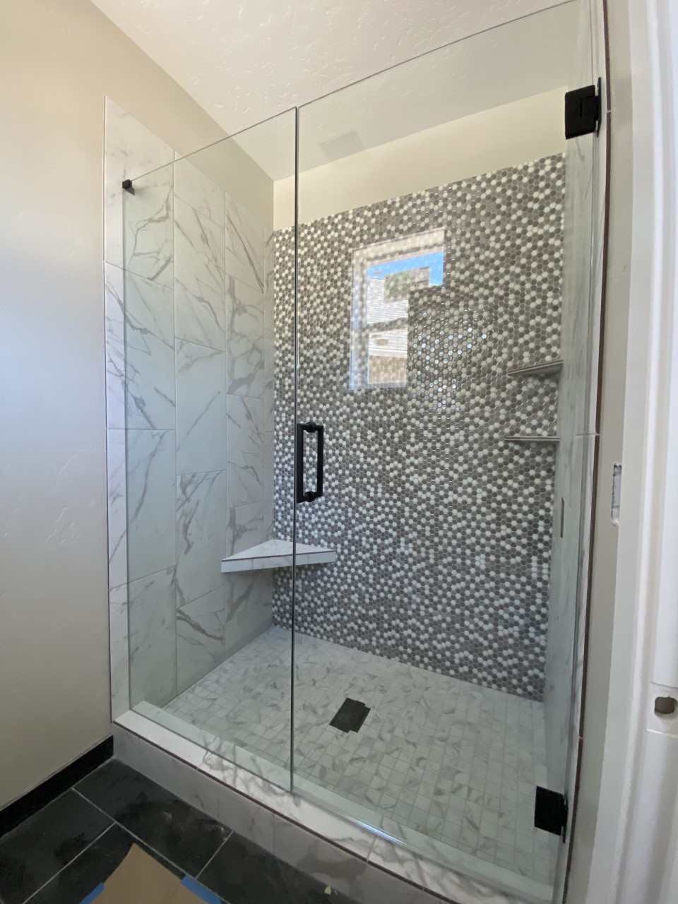 glass shower door with stationary panel installation in bend, oregon